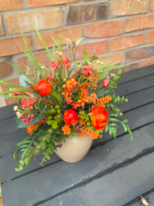 Faux Floral Orange Colouring in Beige Vase